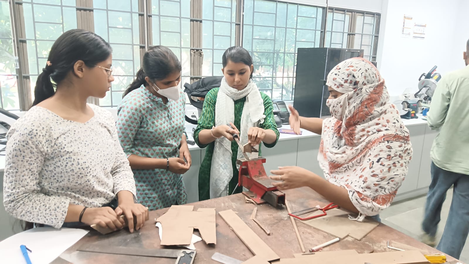 A wooden table designed by design students for use with a hand router